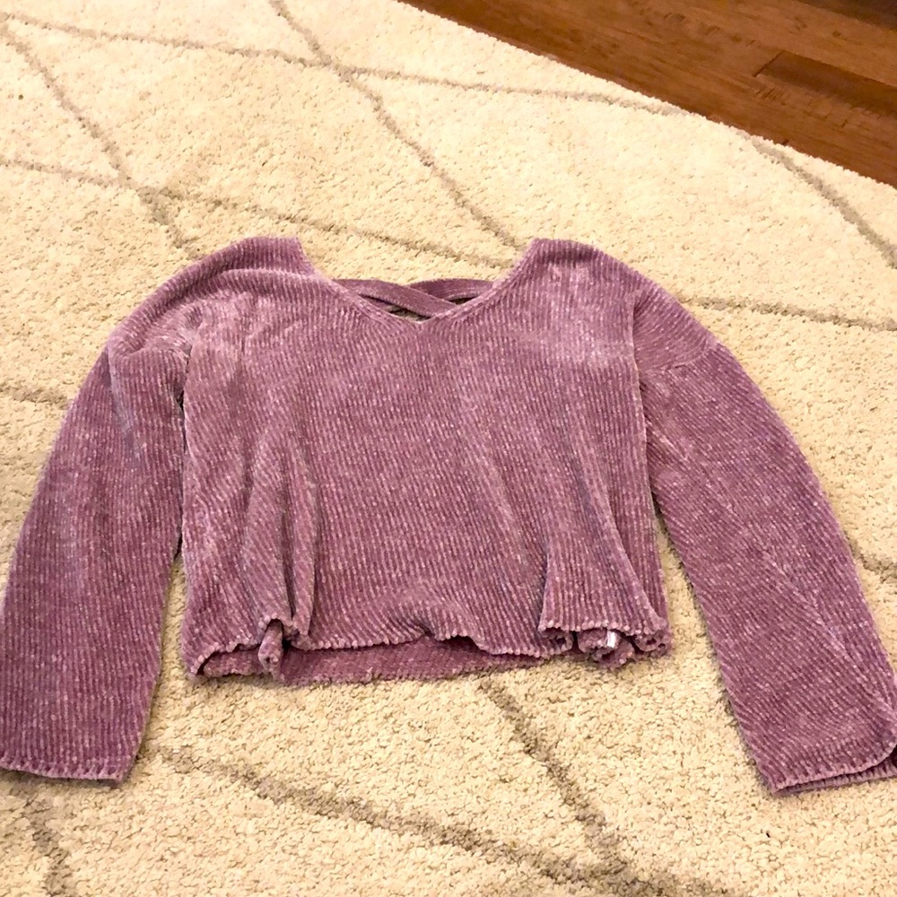 Pink sweater, cross-cross back